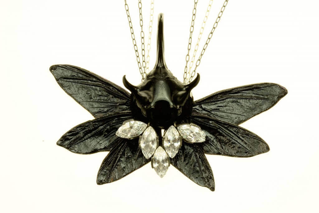 Necklace by Bartosz Maria Chmielewski; Materials: silver, oxidised silver chitin, leaf beetle, epoxy resin